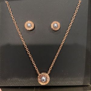 Coach necklace and earring set rose gold